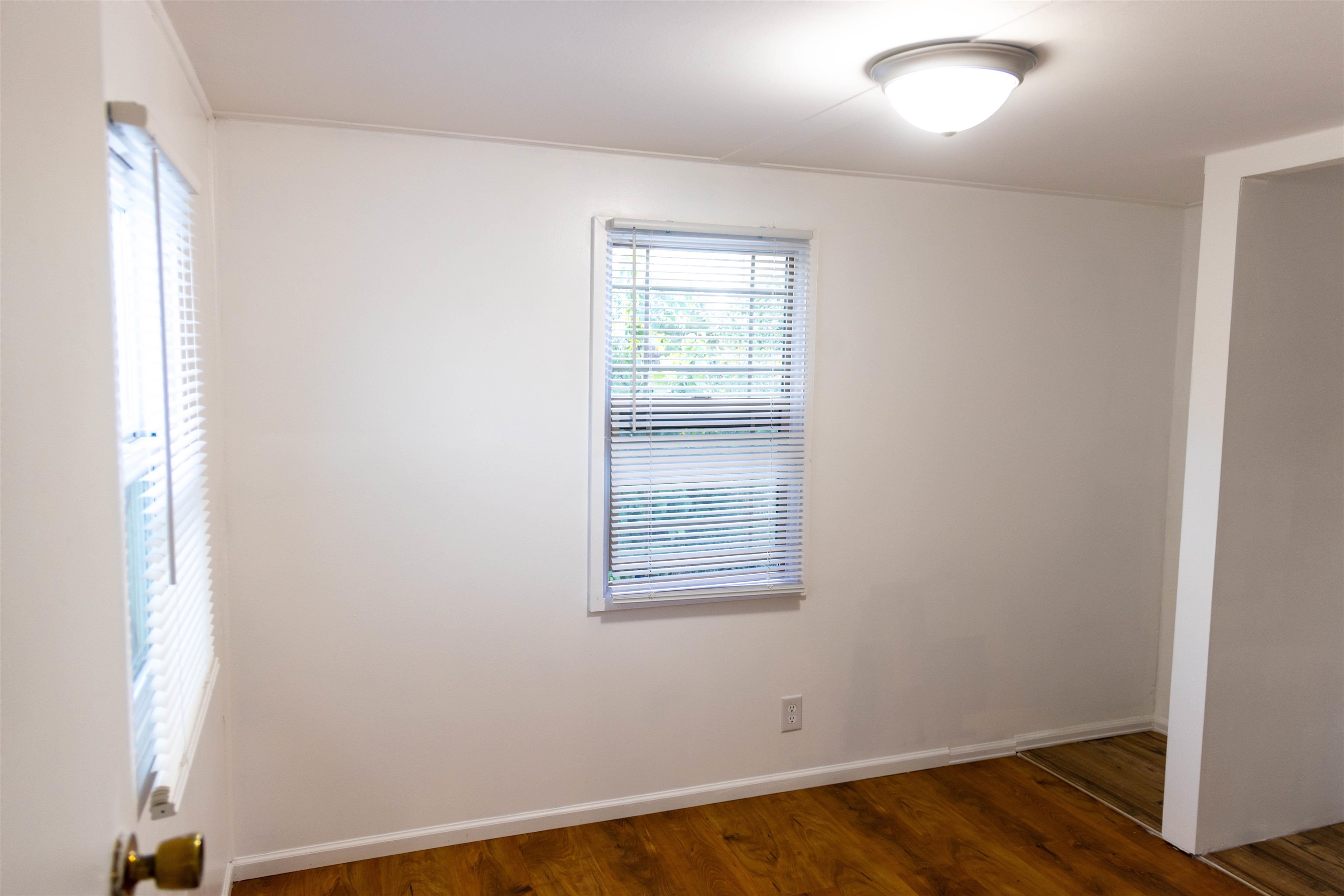 585-25 25 1/2 Road, Unit 232 Grand Junction, CO 81505 - Photo 32 of 40 an empty room with wooden floor and windows
