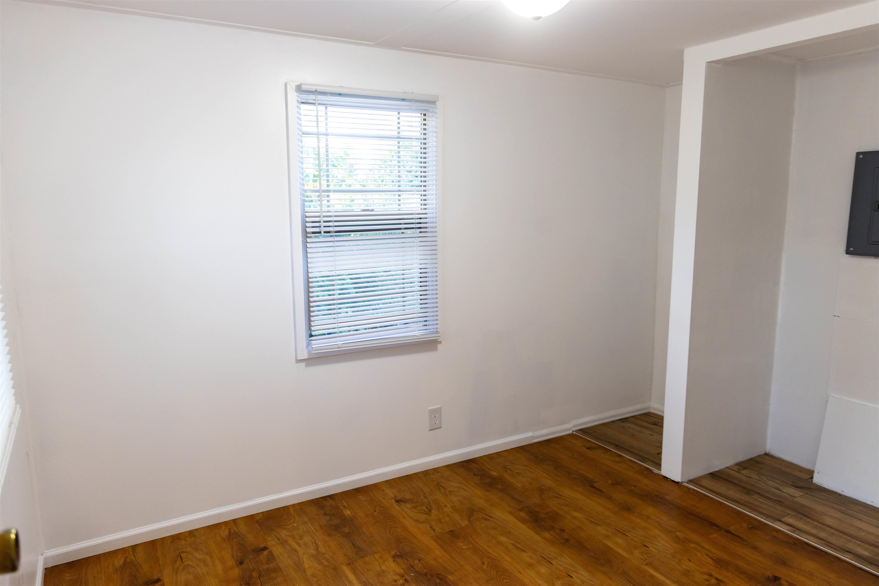 585-25 25 1/2 Road, Unit 232 Grand Junction, CO 81505 - Photo 34 of 40 an empty room with wooden floor and windows