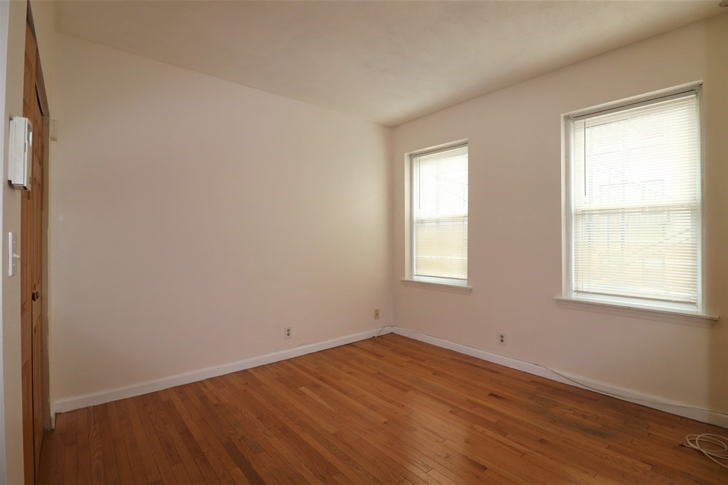 1427 Commonwealth Avenue, Unit 302 Boston, MA 02135 - Photo 8 of 12 an empty room with a window