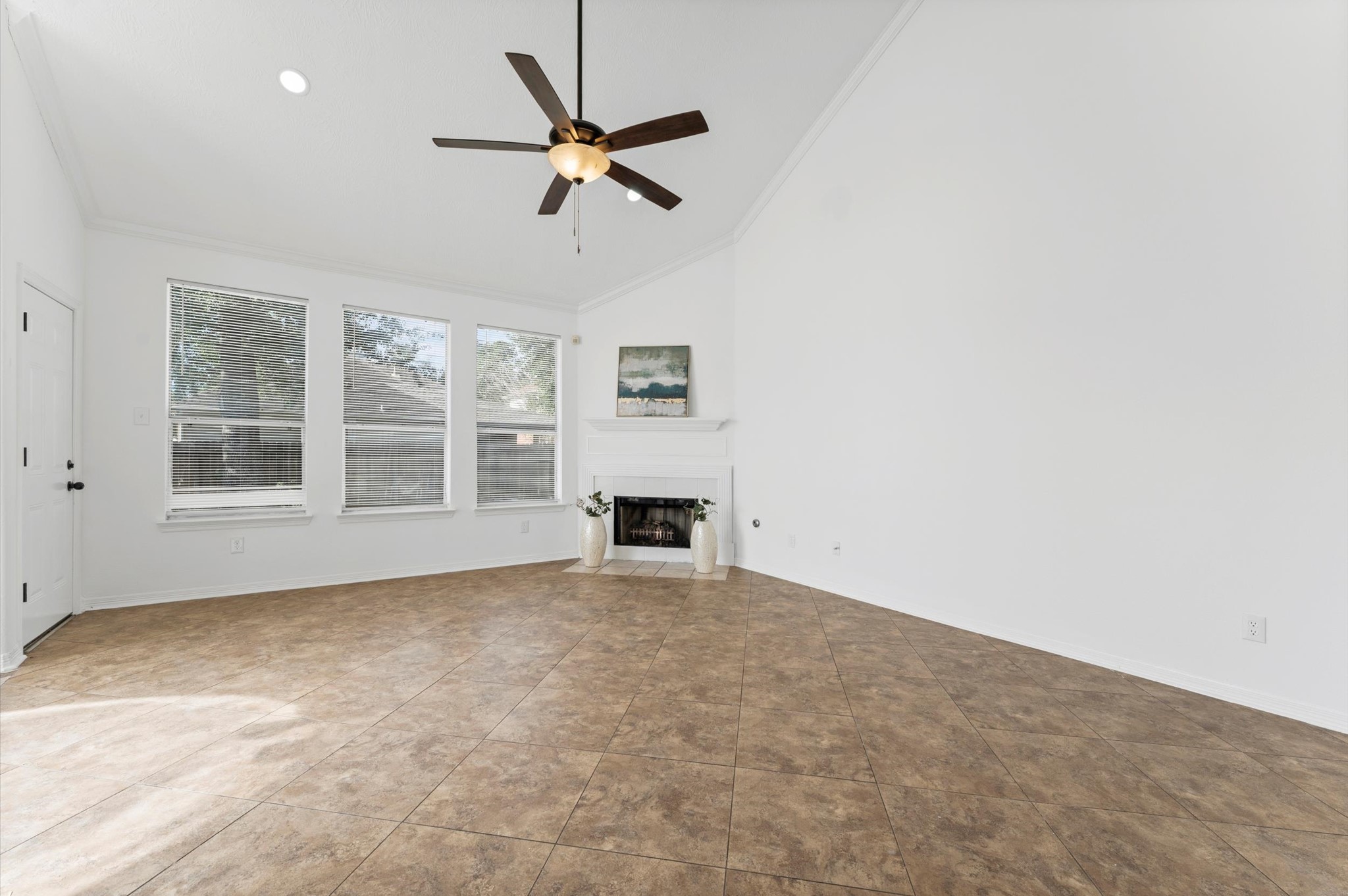 23827 Spring Dane Drive Spring, TX 77373 - Photo 14 of 36 an empty room with windows and fireplace
