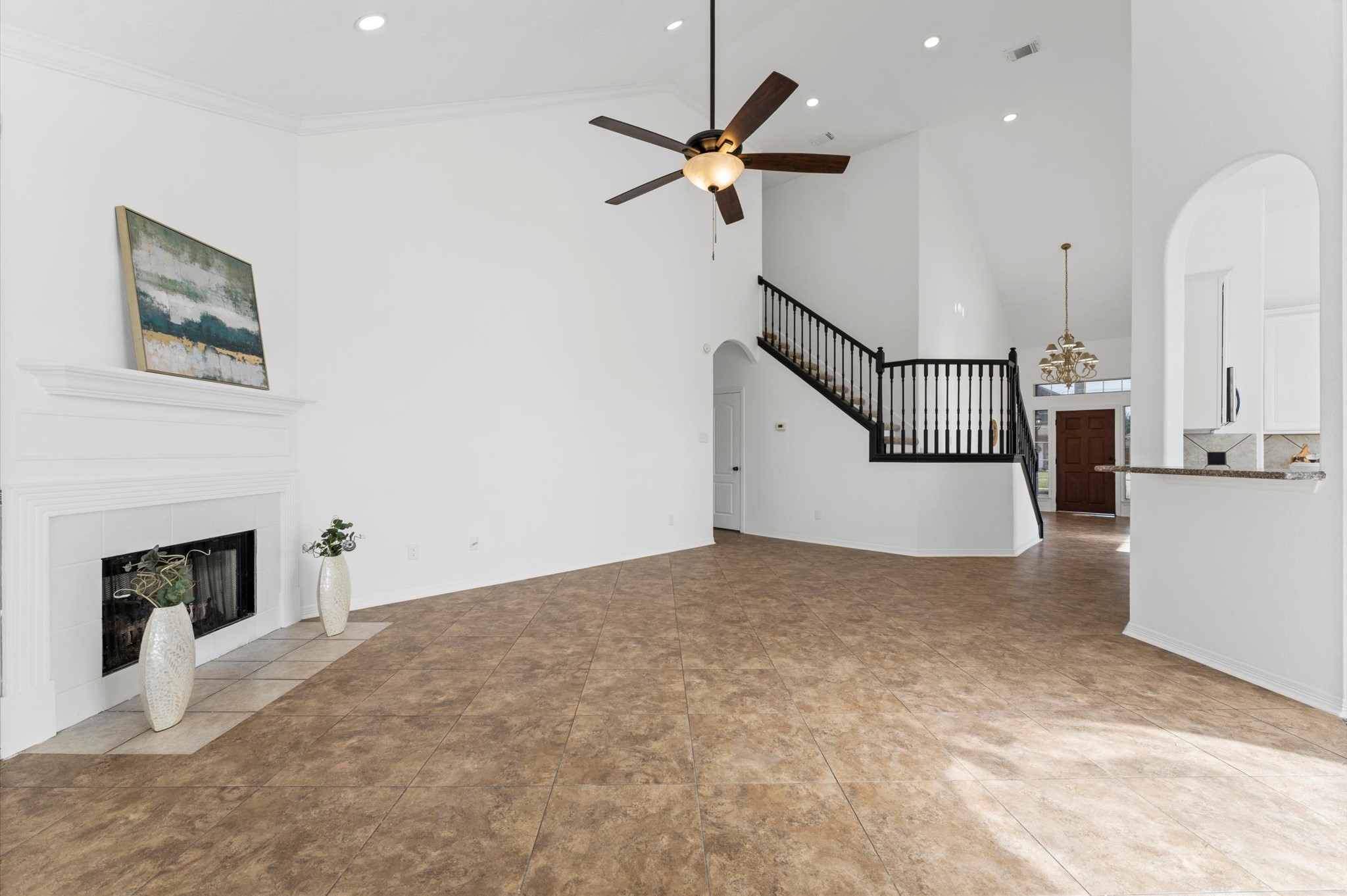 23827 Spring Dane Drive Spring, TX 77373 - Photo 33 of 36 a view of a livingroom with a ceiling fan a fireplace