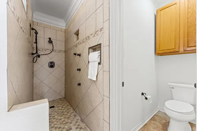 a spacious bathroom with a double vanity sink mirror and bathtub