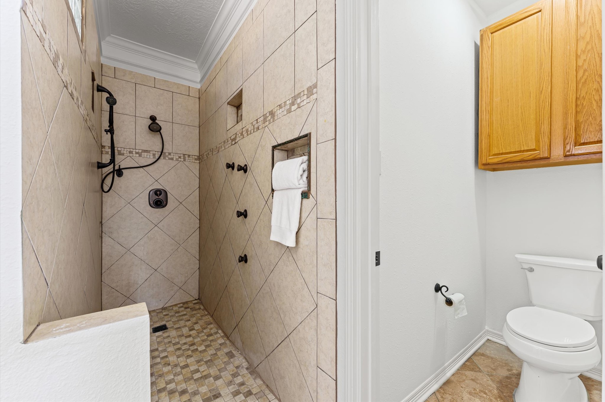23827 Spring Dane Drive Spring, TX 77373 - Photo 18 of 36 a bathroom with a granite countertop shower and a toilet