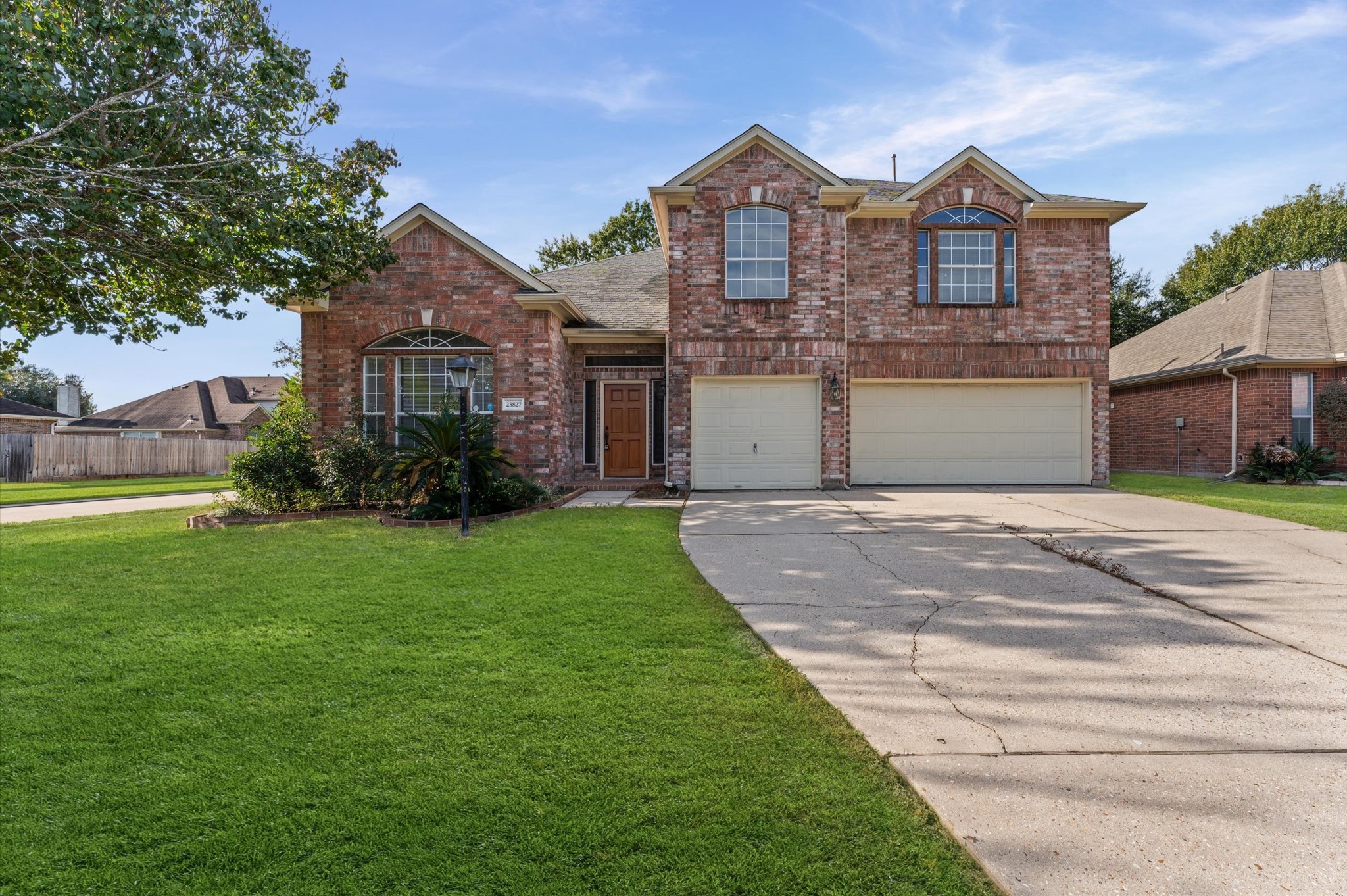 23827 Spring Dane Drive Spring, TX 77373 - Photo 2 of 36 a front view of a house with garden
