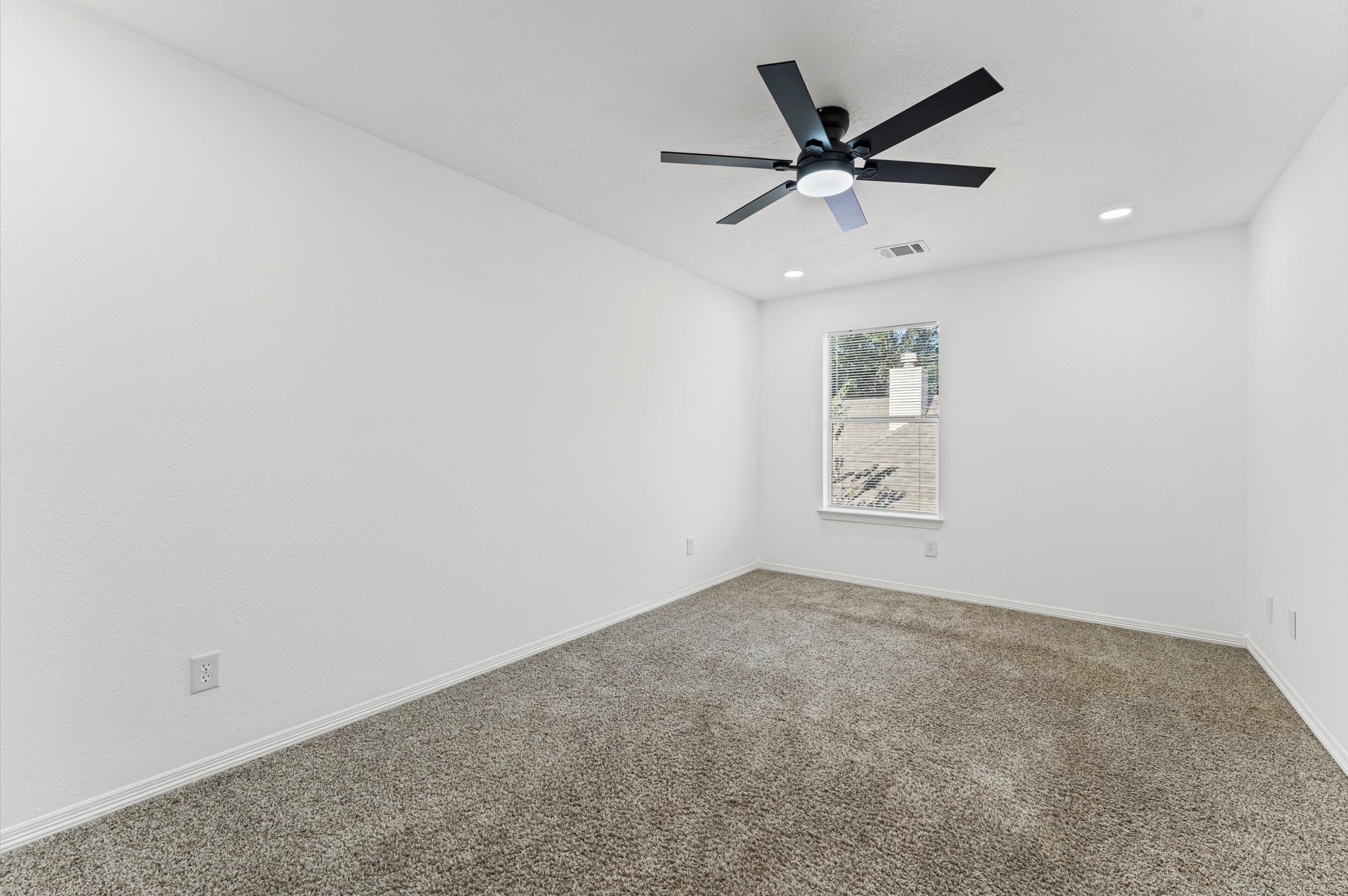 23827 Spring Dane Drive Spring, TX 77373 - Photo 24 of 36 an empty room with ceiling fan and window