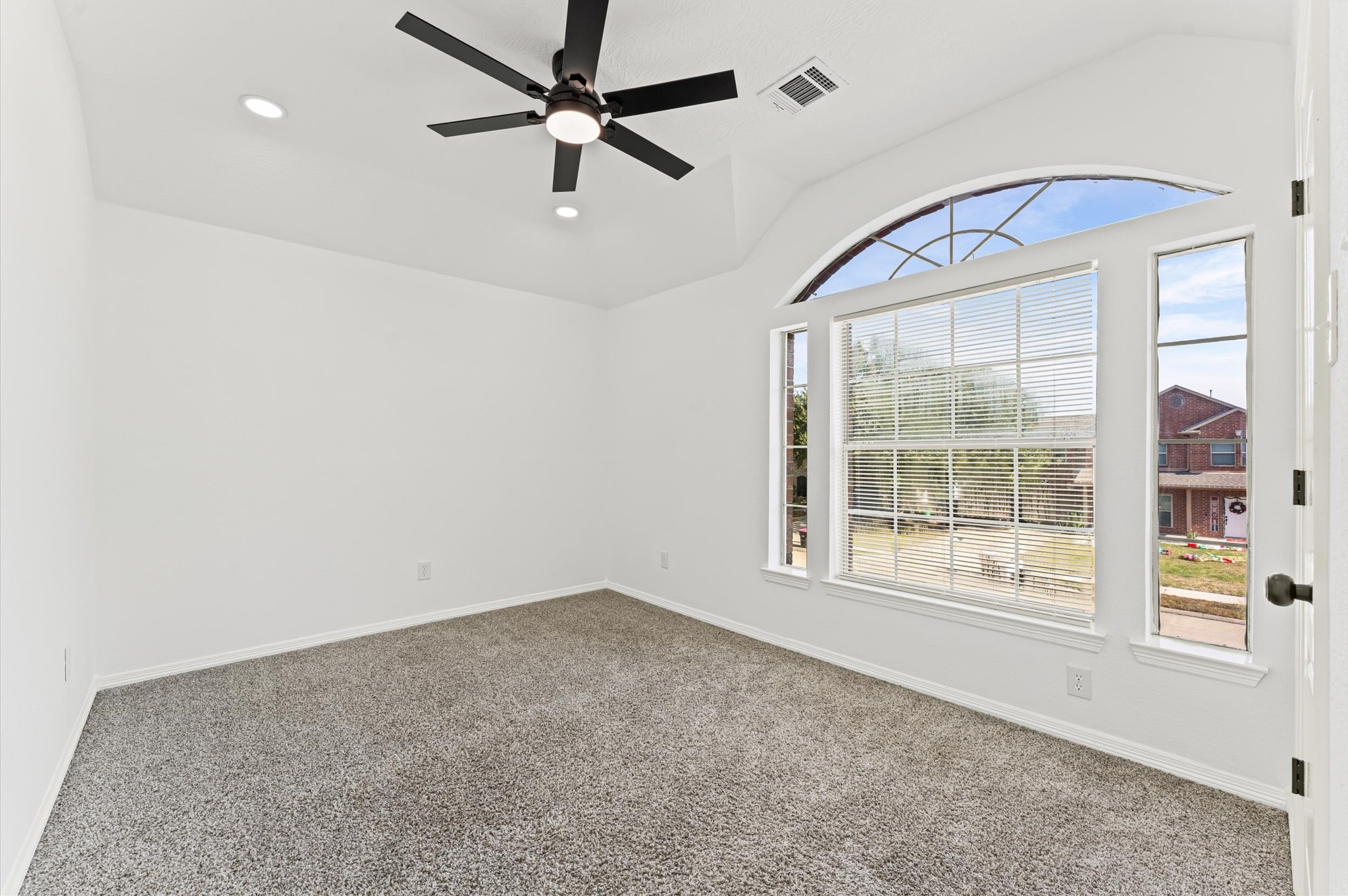 23827 Spring Dane Drive Spring, TX 77373 - Photo 26 of 36 an empty room with windows and fan
