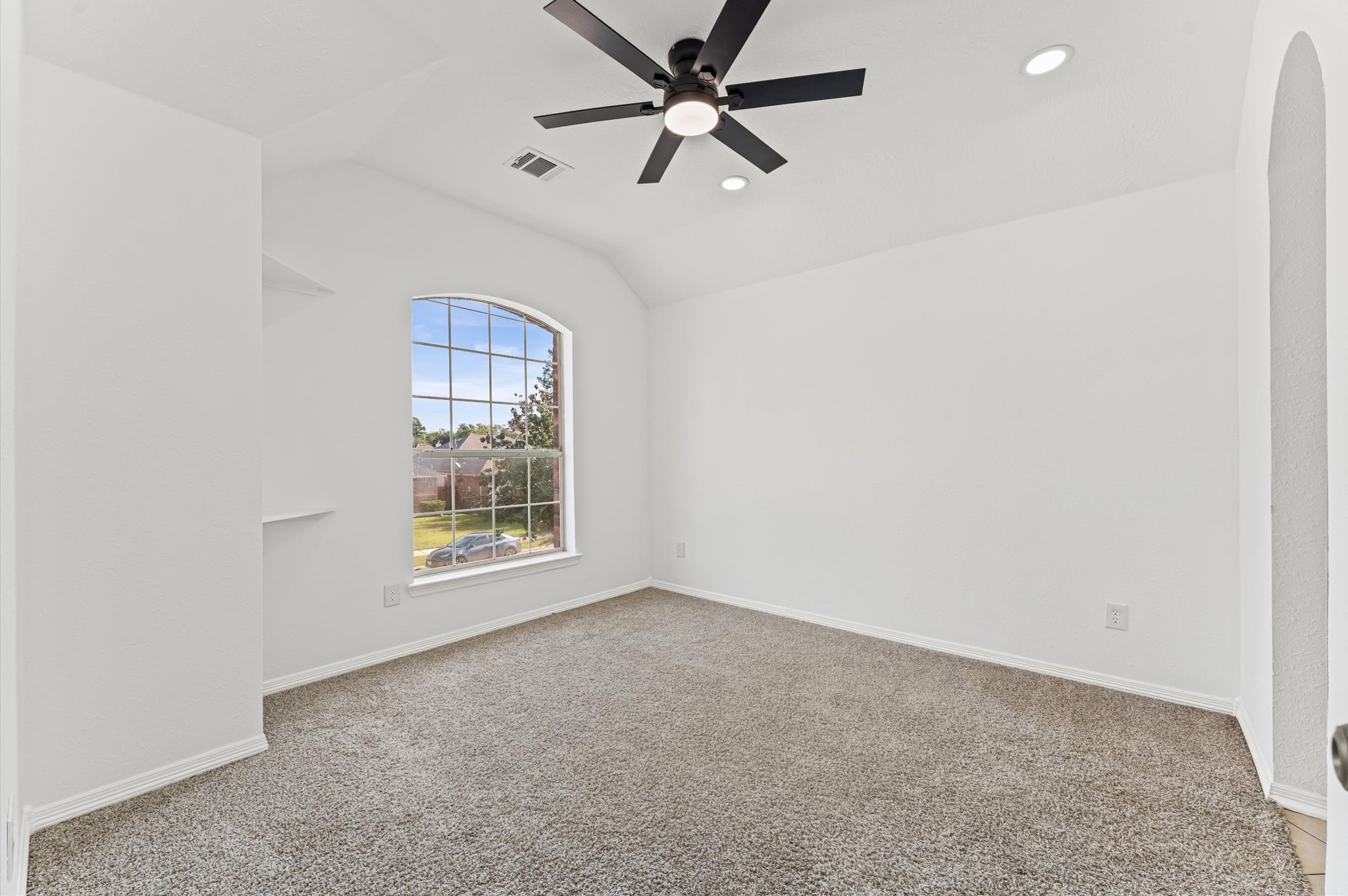 23827 Spring Dane Drive Spring, TX 77373 - Photo 27 of 36 an empty room with a window and a fan