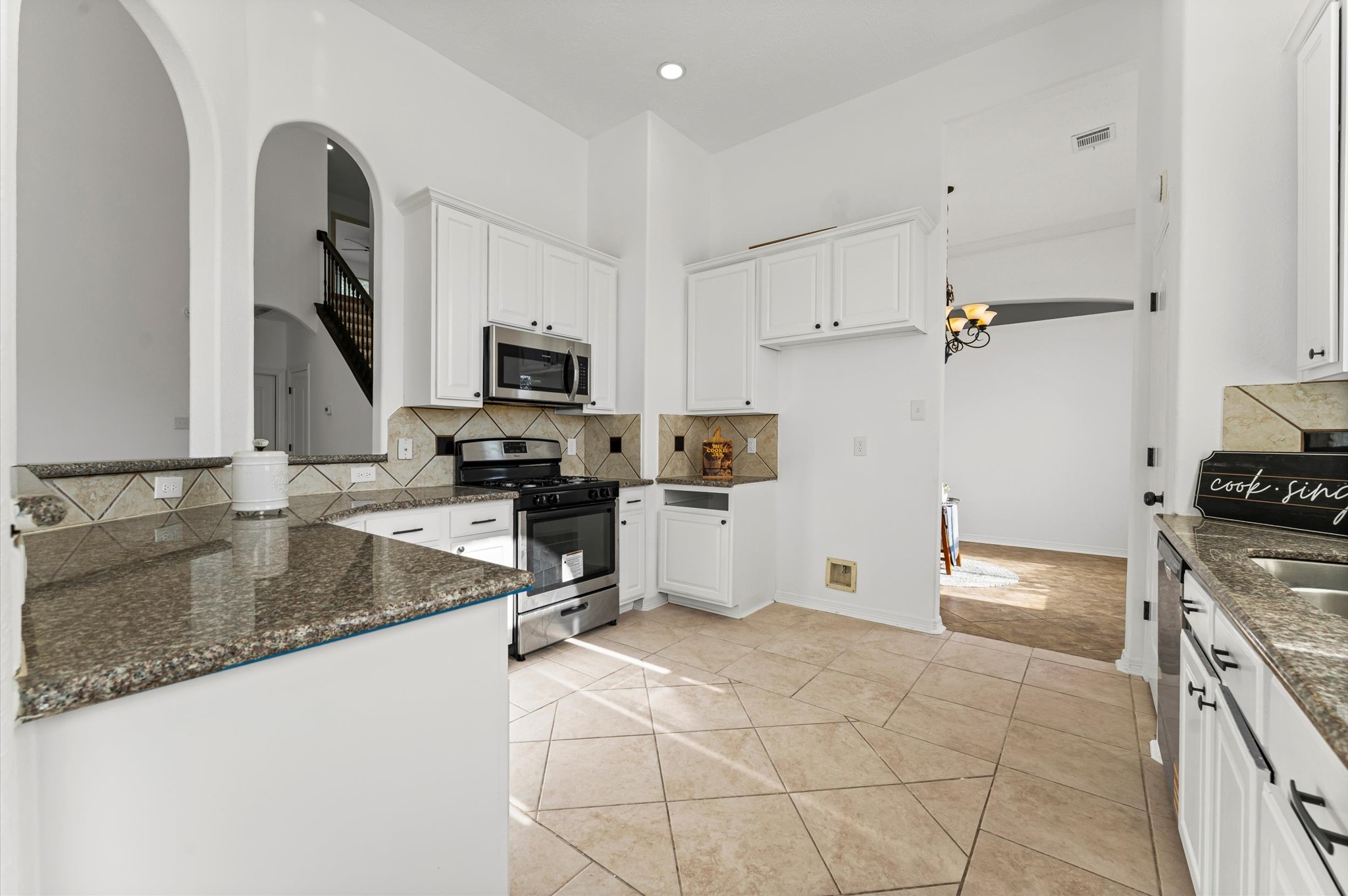 23827 Spring Dane Drive Spring, TX 77373 - Photo 10 of 36 a kitchen with granite countertop a stove and a sink