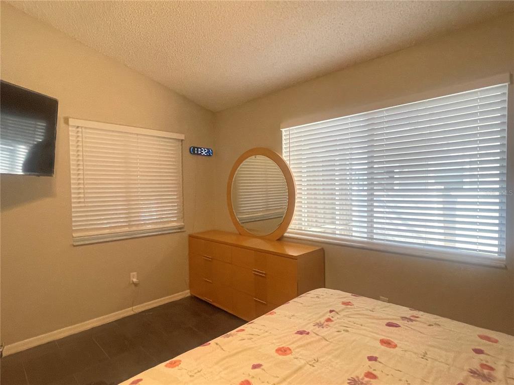 6980 Ulmerton Road, Unit 3G Largo, FL 33771 - Photo 23 of 52 a view of a bedroom with a window