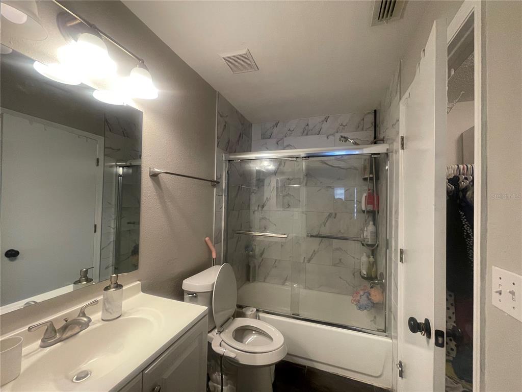 6980 Ulmerton Road, Unit 3G Largo, FL 33771 - Photo 24 of 52 a bathroom with a sink and a mirror