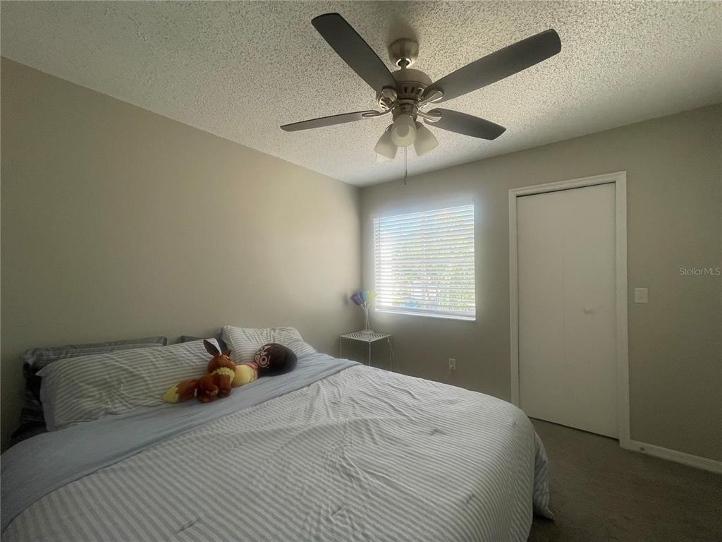 6980 Ulmerton Road, Unit 3G Largo, FL 33771 - Photo 25 of 52 a bedroom with a bed and window