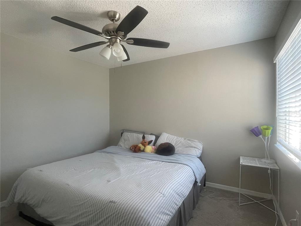 6980 Ulmerton Road, Unit 3G Largo, FL 33771 - Photo 26 of 52 a bedroom with a bed and window