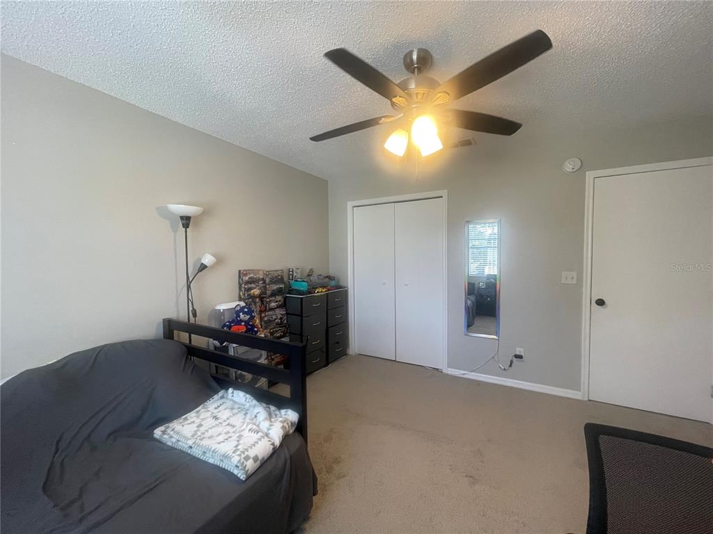 6980 Ulmerton Road, Unit 3G Largo, FL 33771 - Photo 27 of 52 a living room with furniture and a chandelier