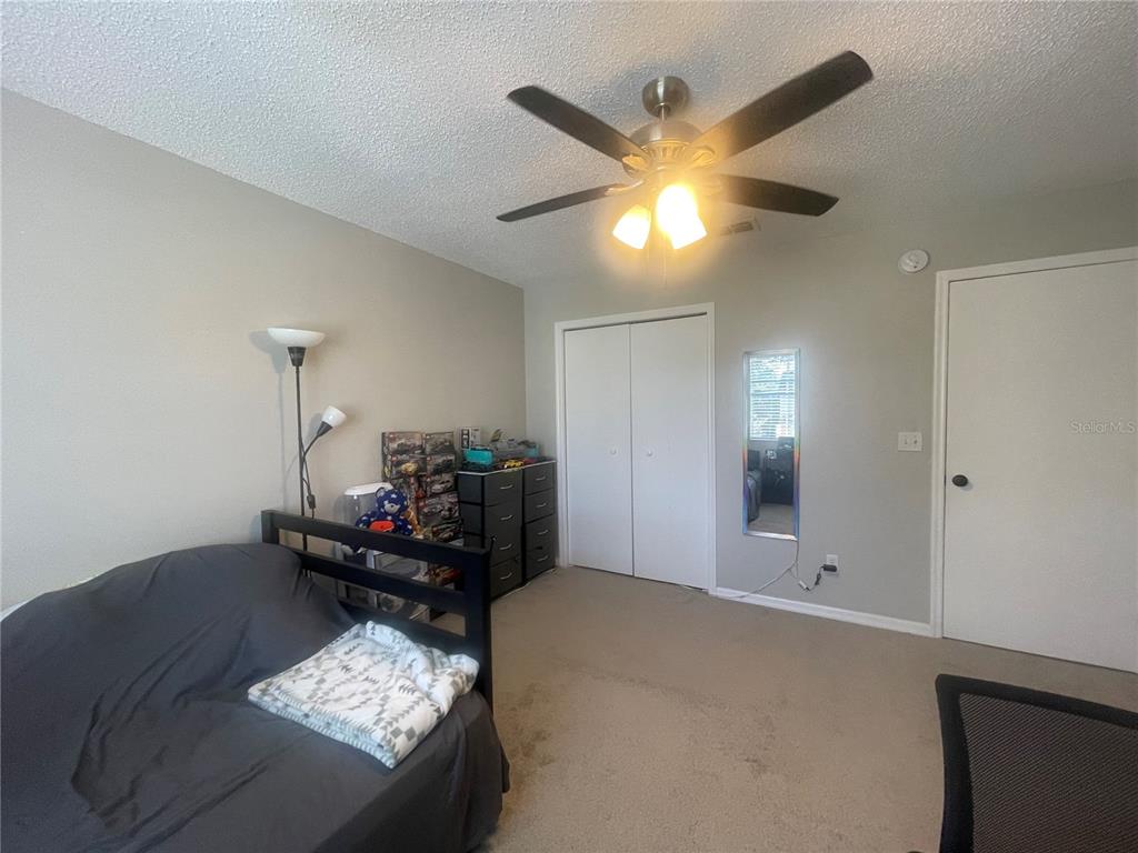 6980 Ulmerton Road, Unit 3G Largo, FL 33771 - Photo 29 of 52 a living room with furniture and a chandelier