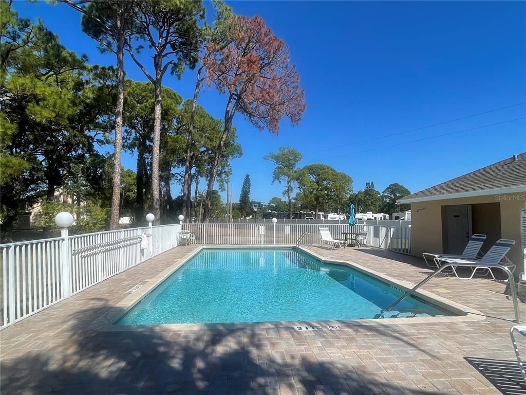6980 Ulmerton Road, Unit 3G Largo, FL 33771 - Photo 44 of 52 a view of a swimming pool with lounge chair