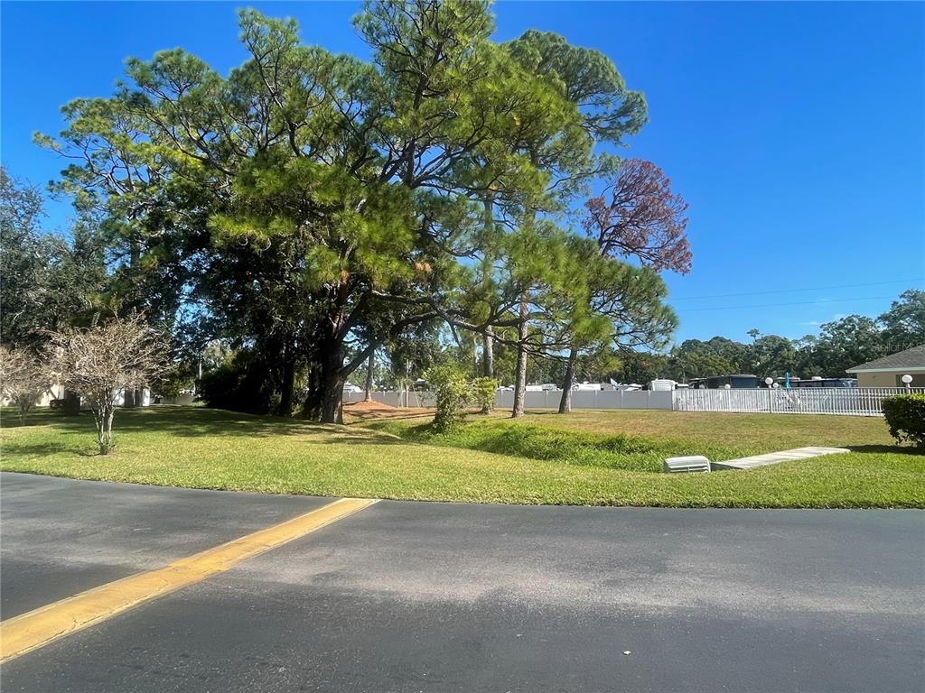 6980 Ulmerton Road, Unit 3G Largo, FL 33771 - Photo 48 of 52 a view of a golf course with a lake