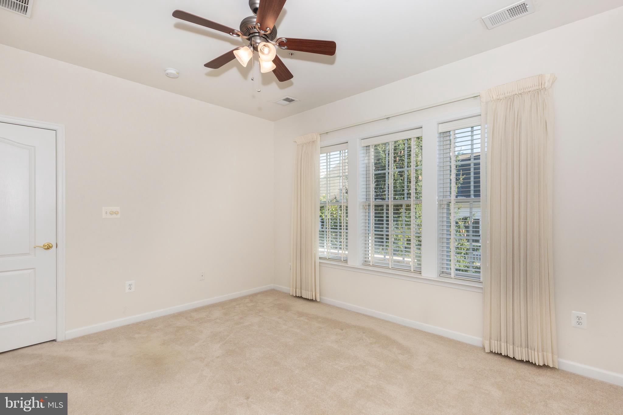 172 Saddletop Drive, Unit 364 Taneytown, MD 21787 - Photo 25 of 38 an empty room with windows and fan
