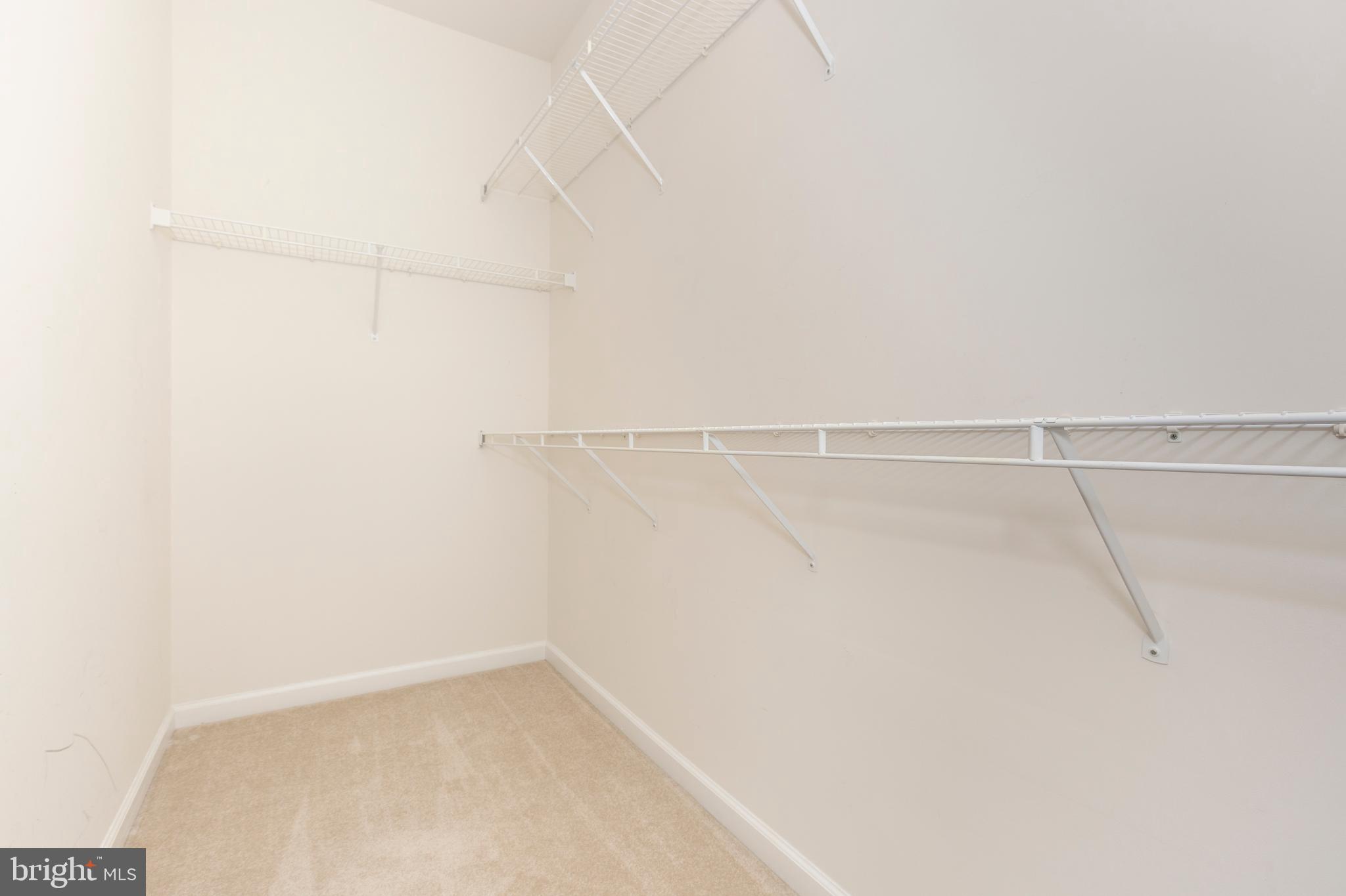 172 Saddletop Drive, Unit 364 Taneytown, MD 21787 - Photo 30 of 38 a view of a room with racks on the wall