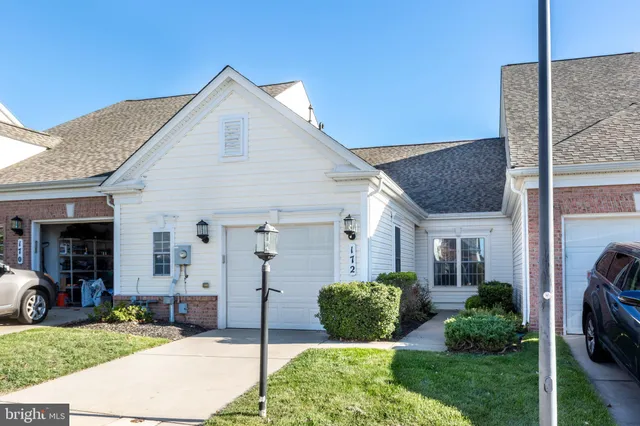 a view of a house with backyard porch and garden