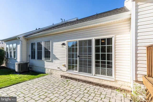 a view of a porch with wooden fence