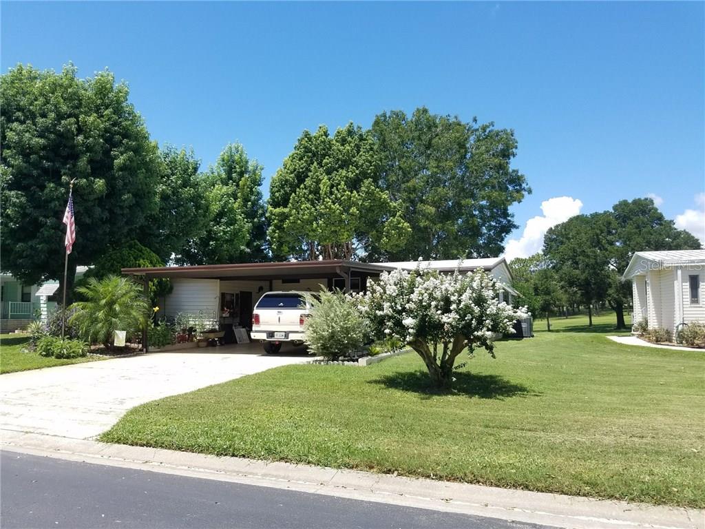 2490 Putter Road, Unit 1606 Zellwood, FL 32798 - Photo 1 of 1 front view of a house with a yard