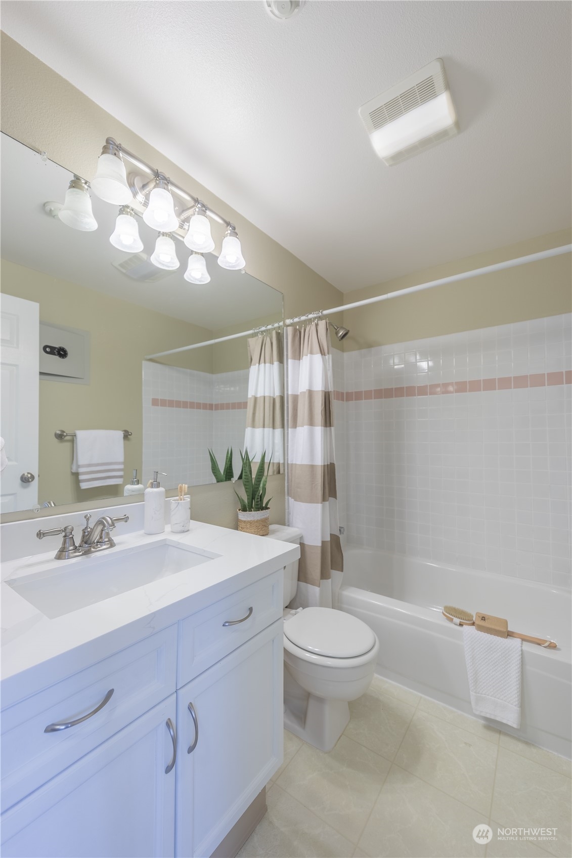 10909 Avondale Road Northeast, Unit M149 Redmond, WA 98052 - Photo 12 of 22 a bathroom with a sink a toilet a mirror and shower