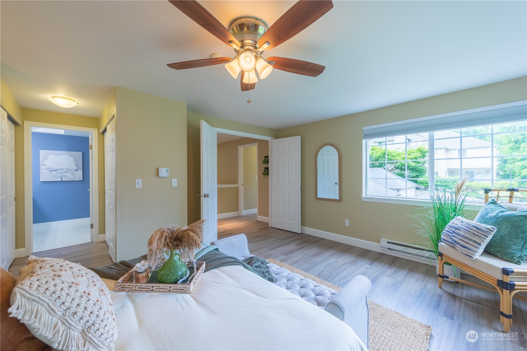 10909 Avondale Road Northeast, Unit M149 Redmond, WA 98052 - Photo 15 of 22 a bedroom with a bed and a large window