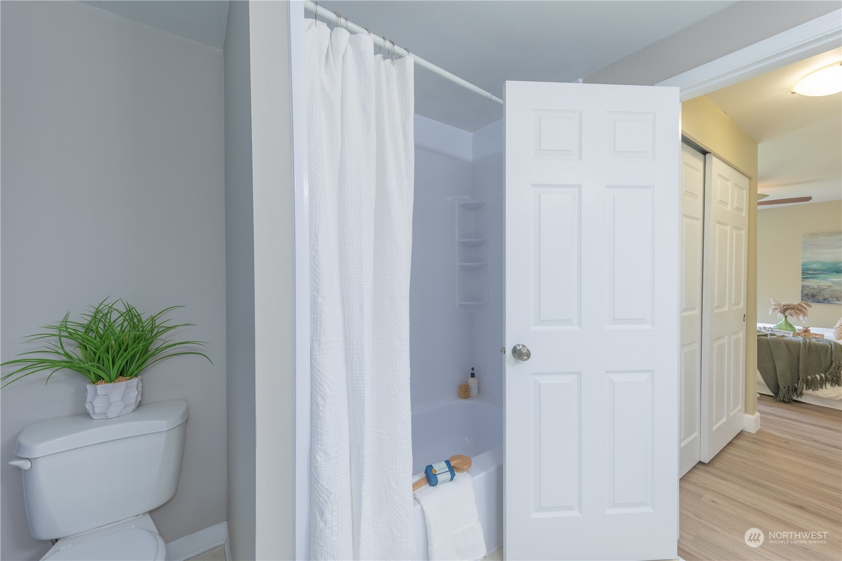 10909 Avondale Road Northeast, Unit M149 Redmond, WA 98052 - Photo 17 of 22 a bathroom with a shower curtain