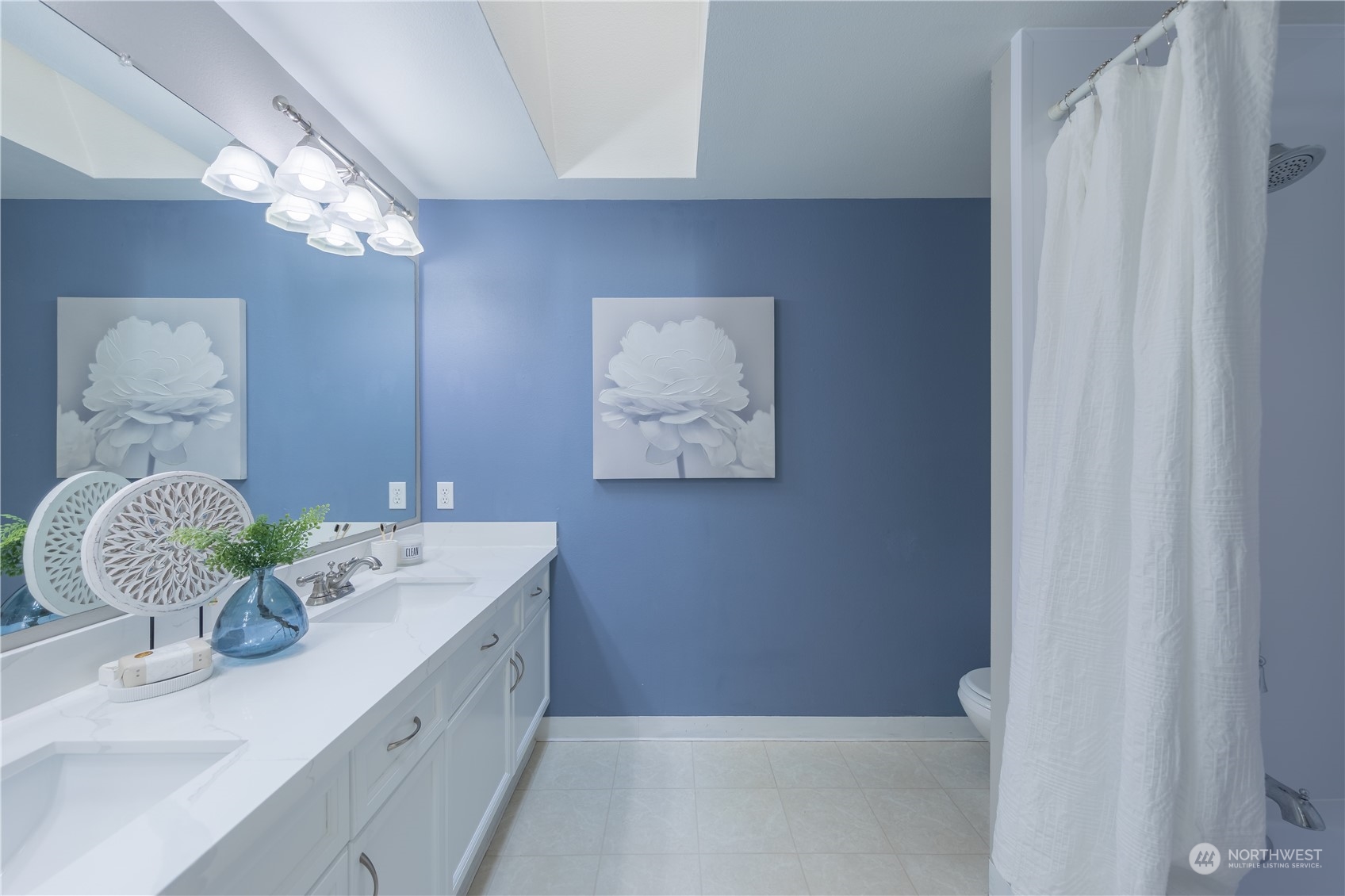 10909 Avondale Road Northeast, Unit M149 Redmond, WA 98052 - Photo 18 of 22 a bathroom with a sink a vanity and a mirror