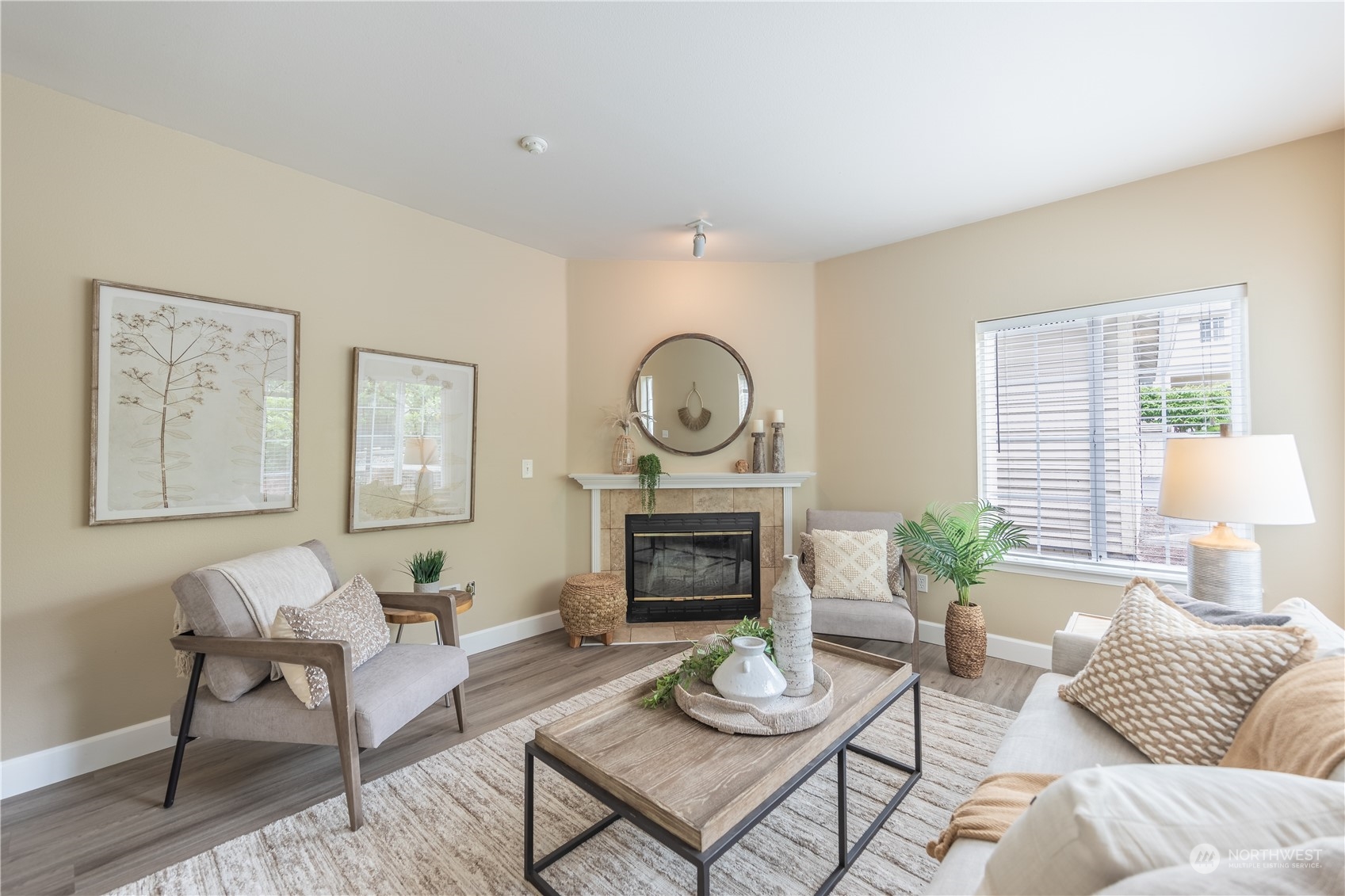 10909 Avondale Road Northeast, Unit M149 Redmond, WA 98052 - Photo 2 of 22 a living room with furniture a fireplace and a large window