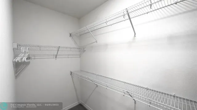 a view of a room with racks on the wall