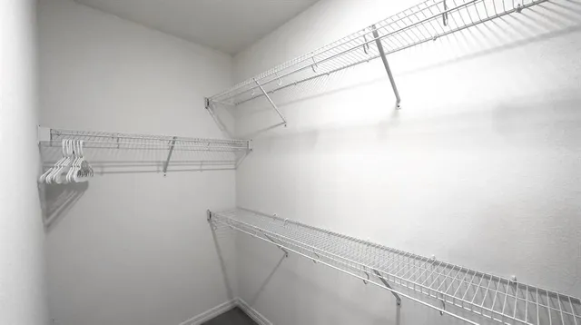 a view of a room with racks on the wall