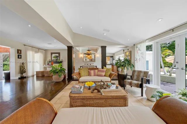 a living room with furniture or couch and a wooden floor