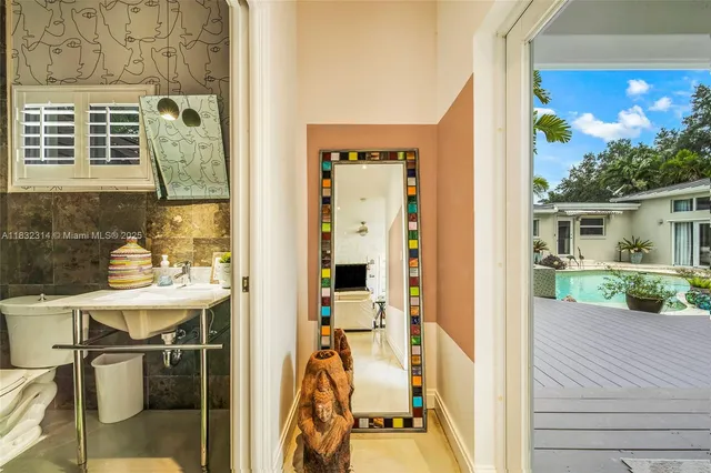 a view of balcony with a table and chairs