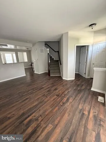 a view of livingroom with window and stairs
