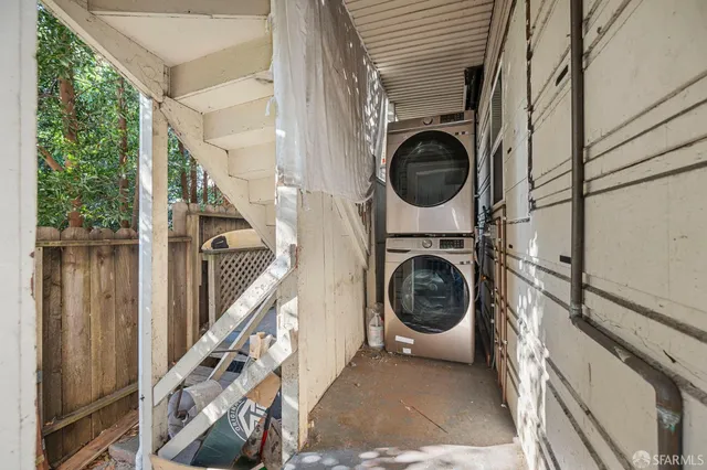 a kitchen with stainless steel appliances kitchen island granite countertop a refrigerator and a stove