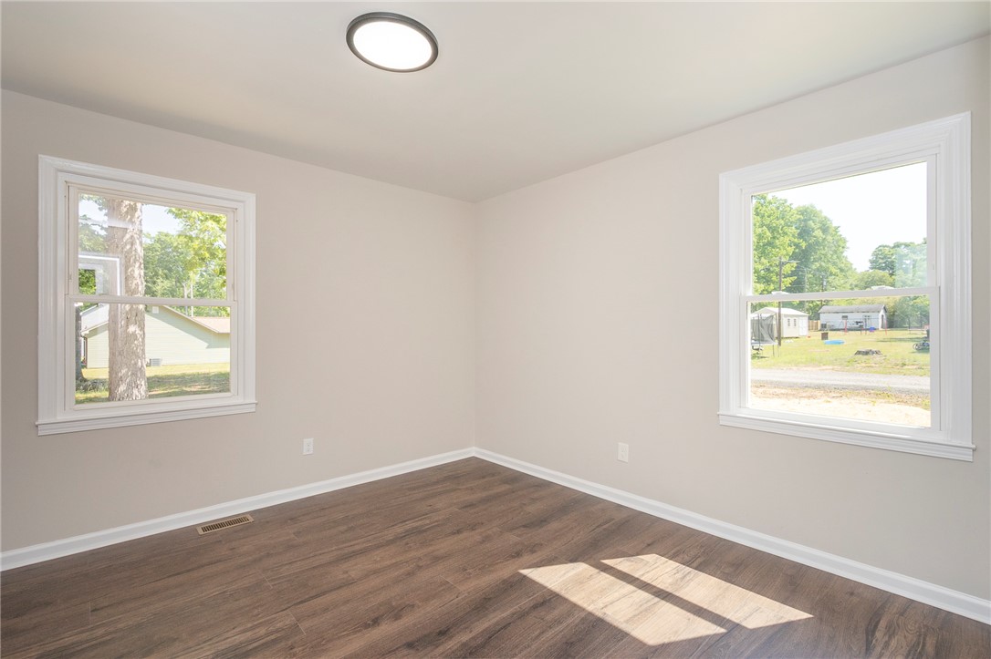 113 Linda Lane Honea Path, SC 29654 - Photo 28 of 36 This bright room features beautiful flooring, ample natural light, and offers views of the neighborhood.