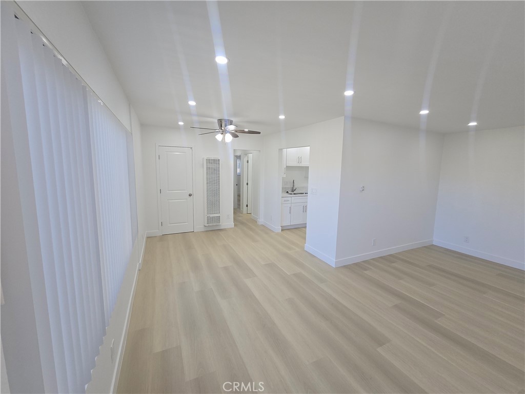 219 15th Street, Unit 12 Huntington Beach, CA 92648 - Photo 3 of 16 a view of a livingroom with a chandelier