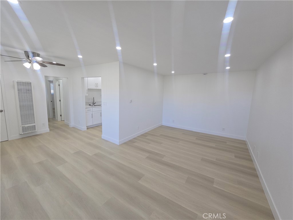 219 15th Street, Unit 12 Huntington Beach, CA 92648 - Photo 4 of 16 a view of a room with a ceiling fan