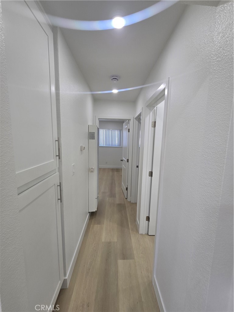 219 15th Street, Unit 12 Huntington Beach, CA 92648 - Photo 7 of 16 a view of a hallway