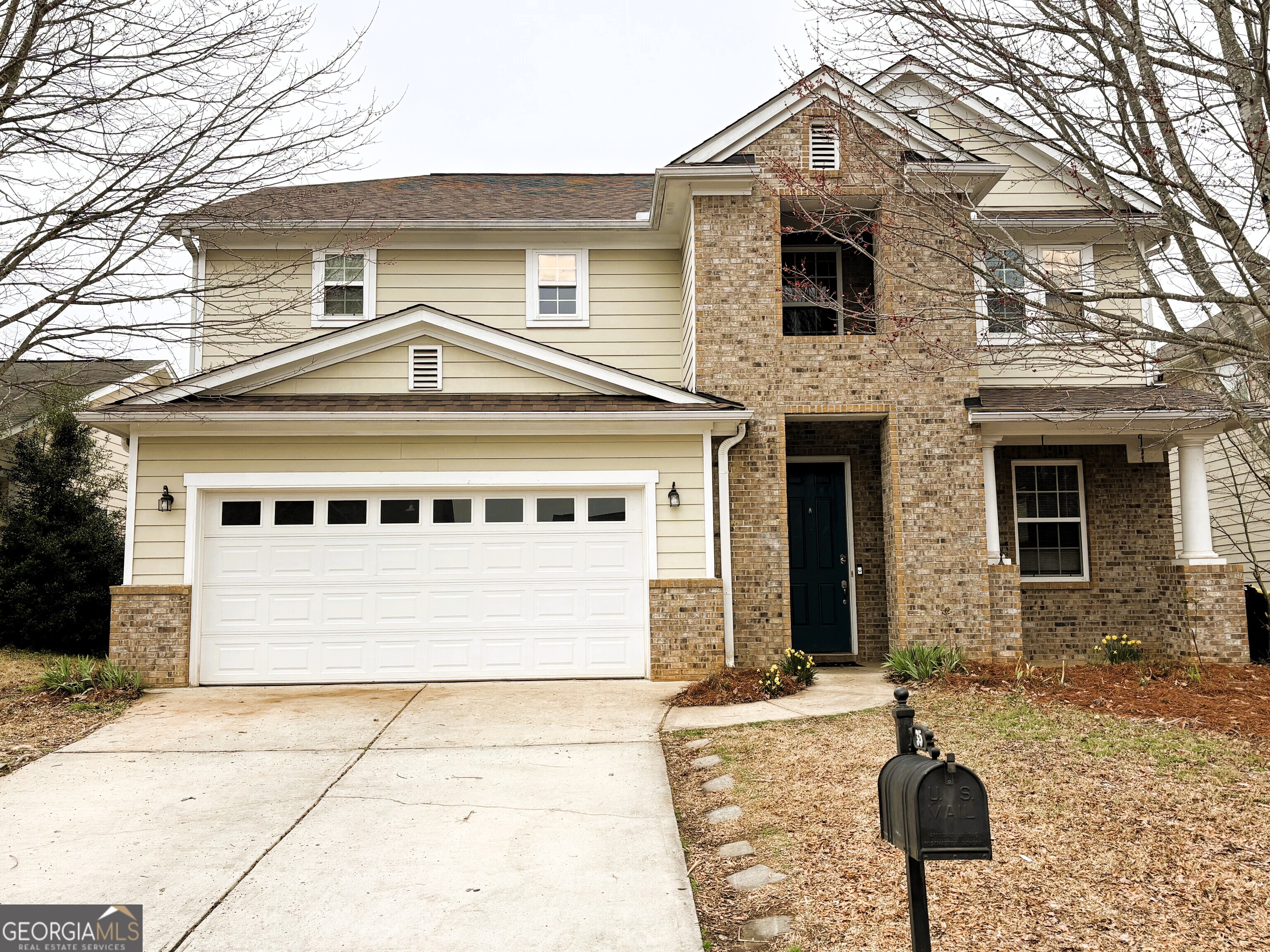 a front view of a house with parking