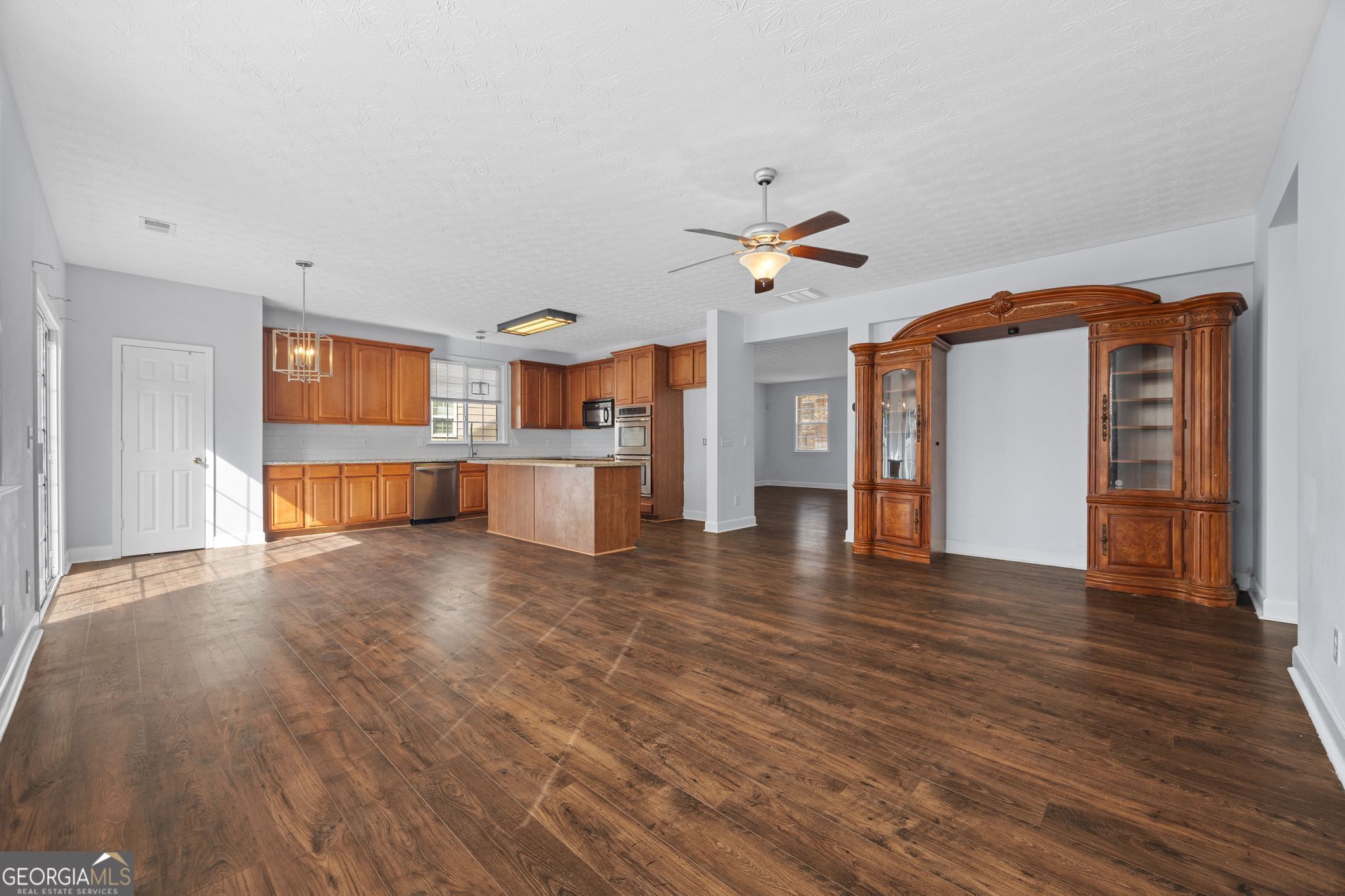 35 Timber Lane Newnan, GA 30265 - Photo 12 of 51 a view of a kitchen with a sink and a stove top oven