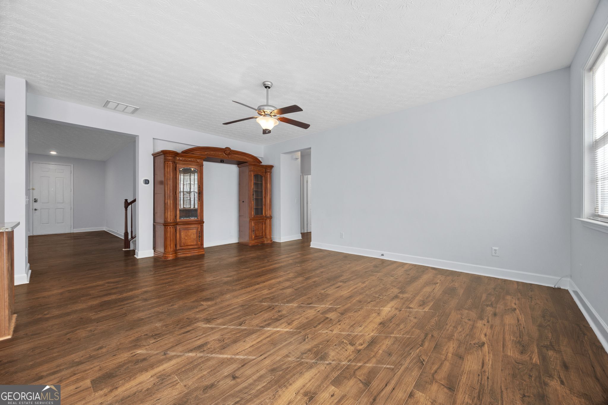 35 Timber Lane Newnan, GA 30265 - Photo 13 of 51 a view of an empty room with wooden floor and a window