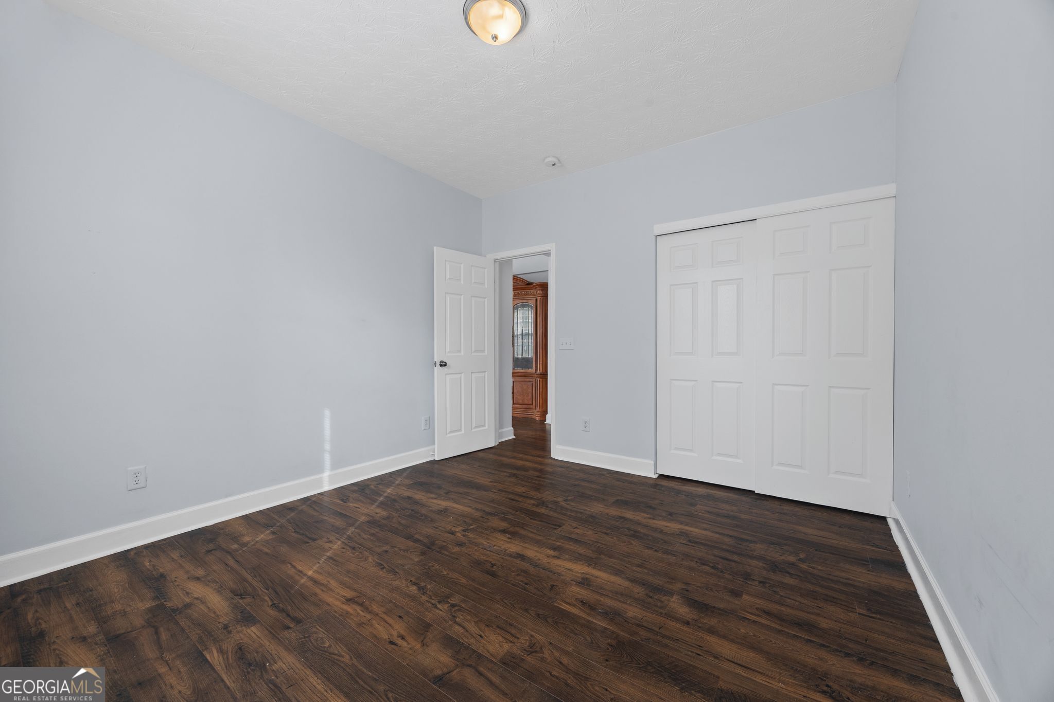 35 Timber Lane Newnan, GA 30265 - Photo 16 of 51 a view of an empty room with wooden floor and closet