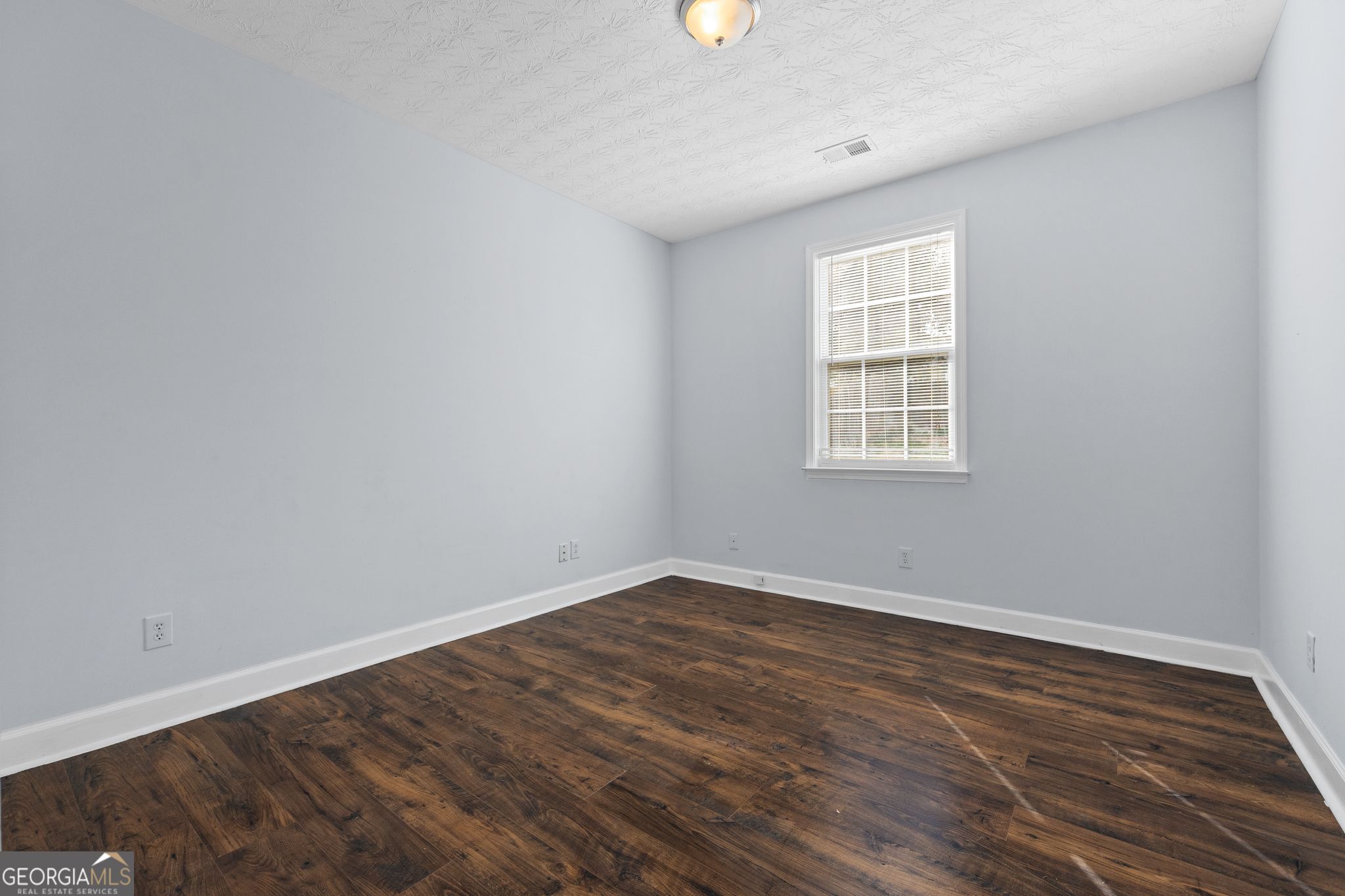 35 Timber Lane Newnan, GA 30265 - Photo 17 of 51 wooden floor in an empty room with a window
