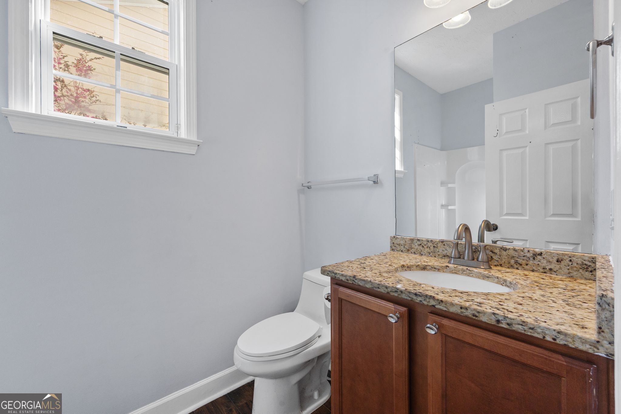 35 Timber Lane Newnan, GA 30265 - Photo 18 of 51 a bathroom with a granite countertop sink toilet and mirror