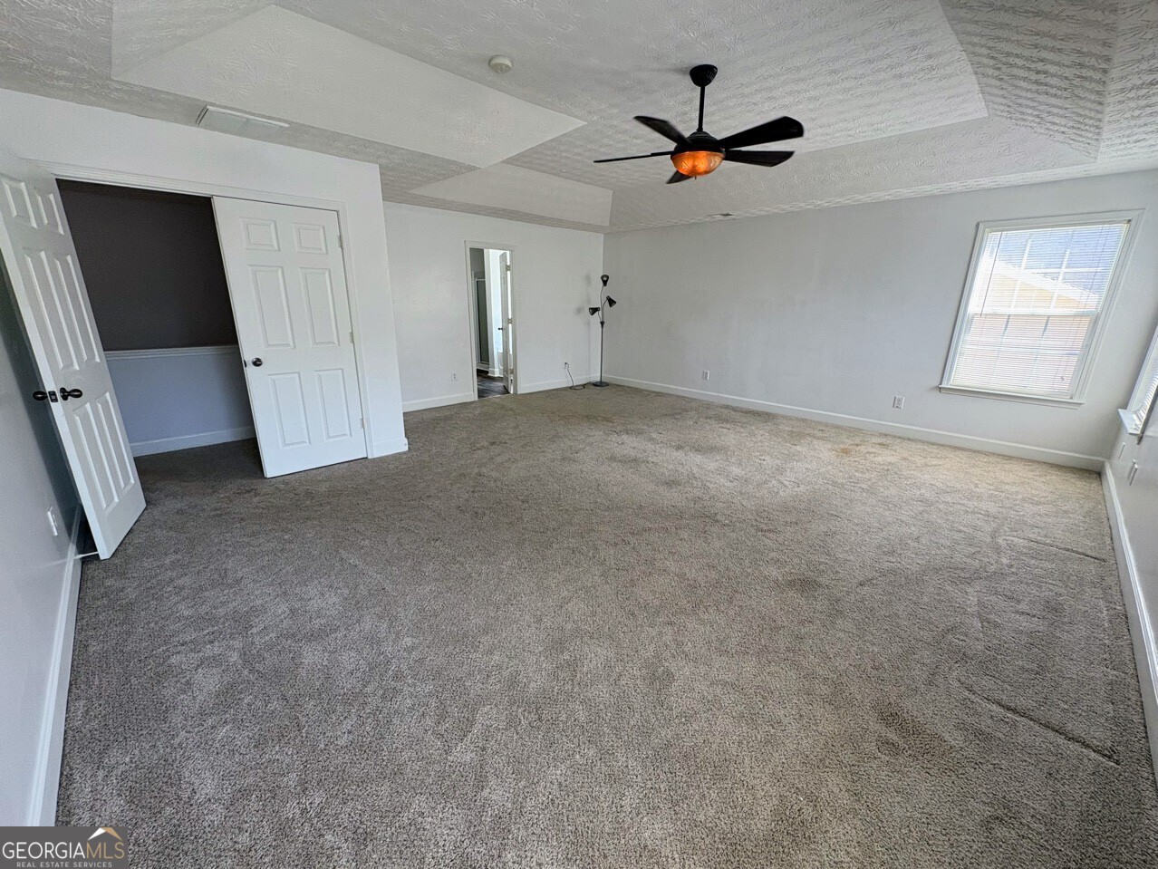 35 Timber Lane Newnan, GA 30265 - Photo 23 of 51 an empty room with ceiling fan and window