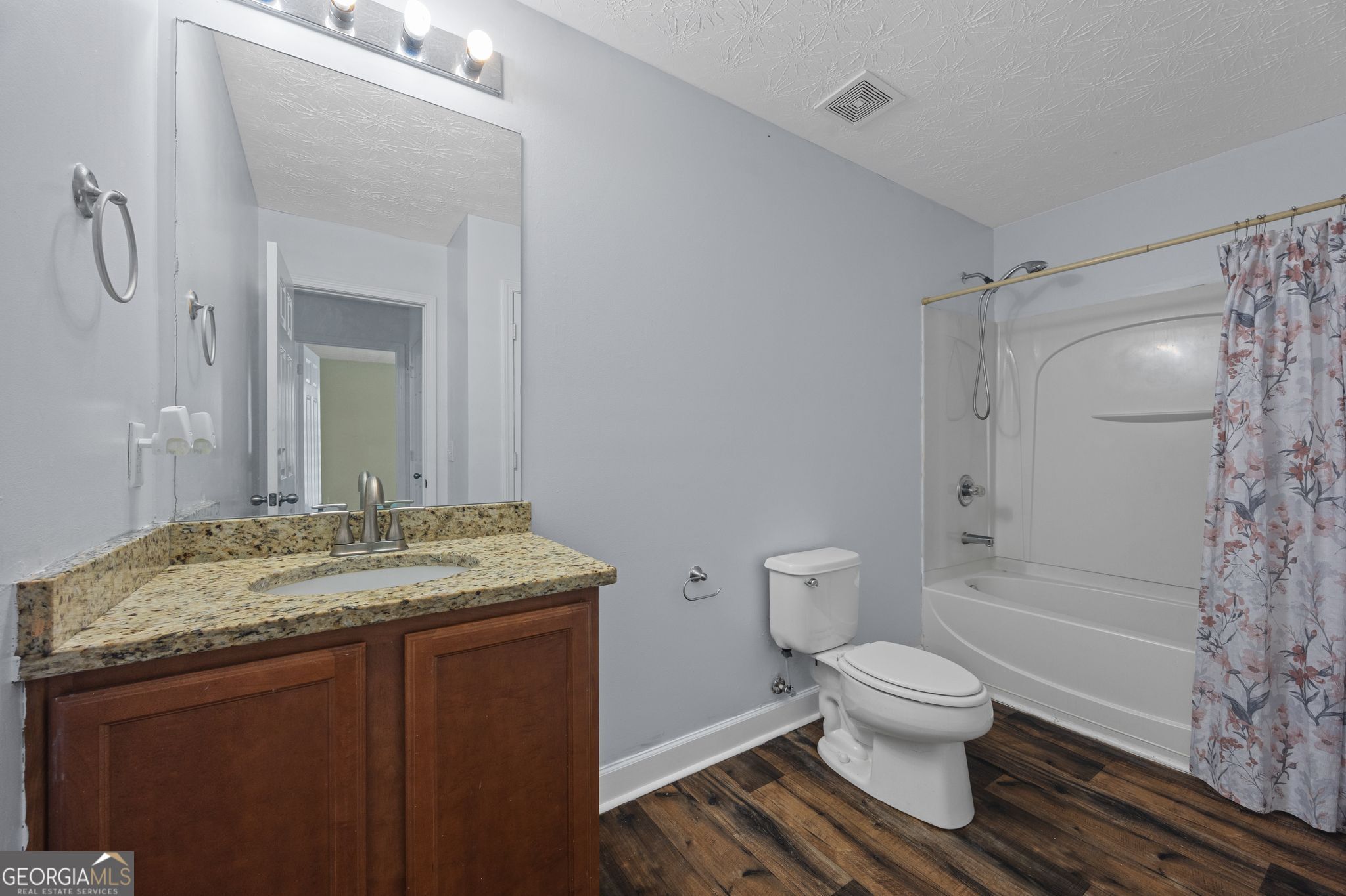 35 Timber Lane Newnan, GA 30265 - Photo 32 of 51 a bathroom with a granite countertop sink toilet and shower