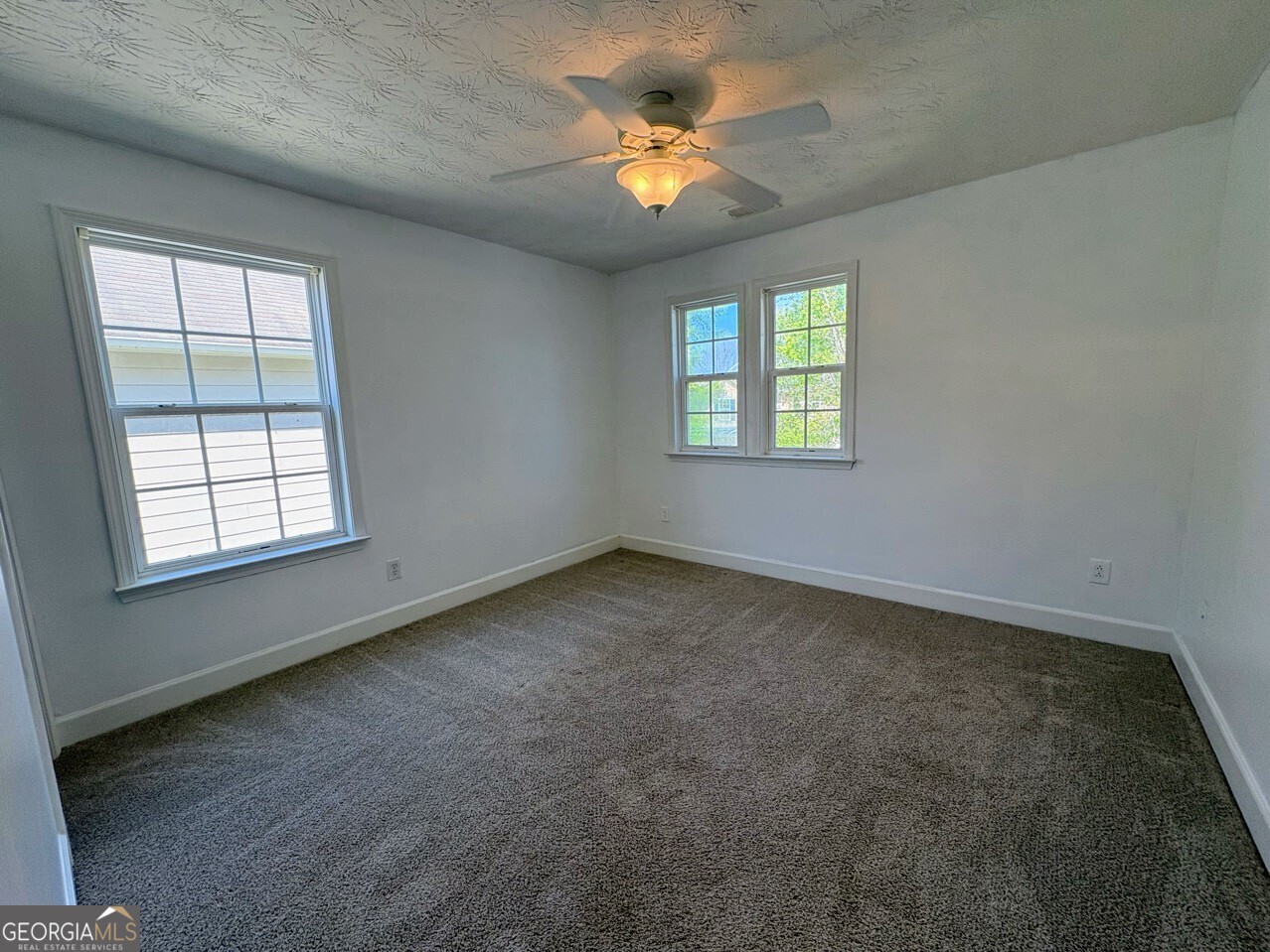 35 Timber Lane Newnan, GA 30265 - Photo 36 of 51 an empty room with a window and a fan