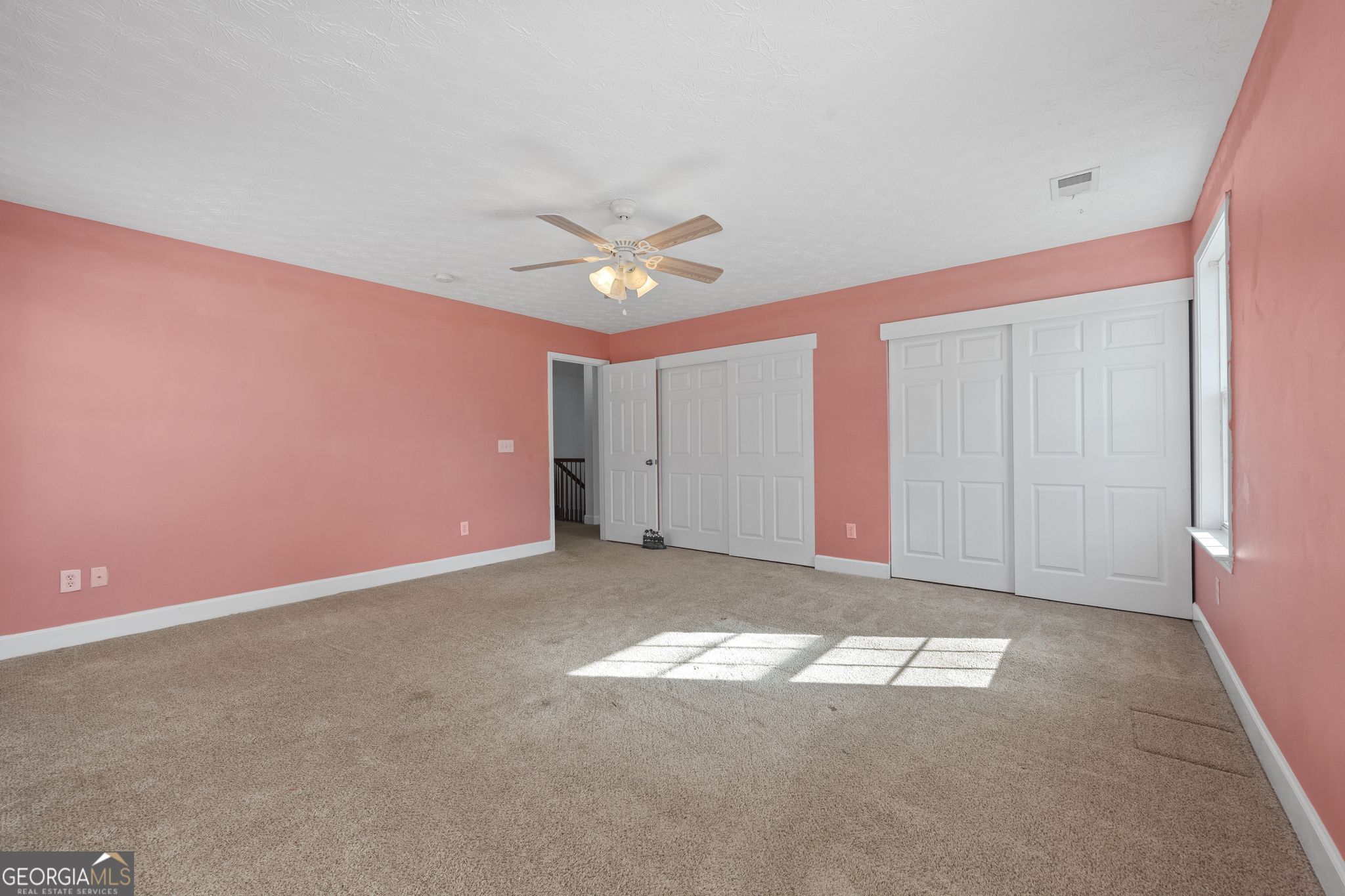 35 Timber Lane Newnan, GA 30265 - Photo 37 of 51 an empty room with a ceiling fan and window